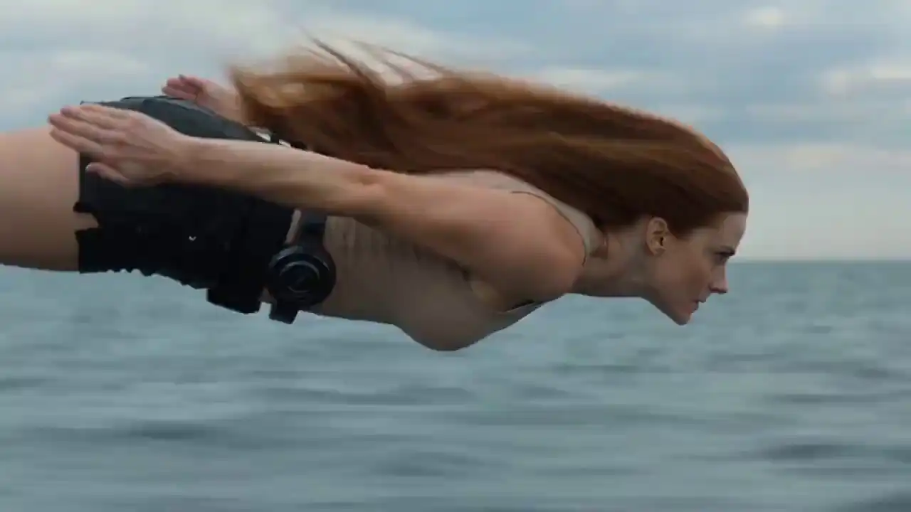 Realistic 4K action of a woman diving into water to rescue a cat with fluid simulations by Seedance 2 Mini.